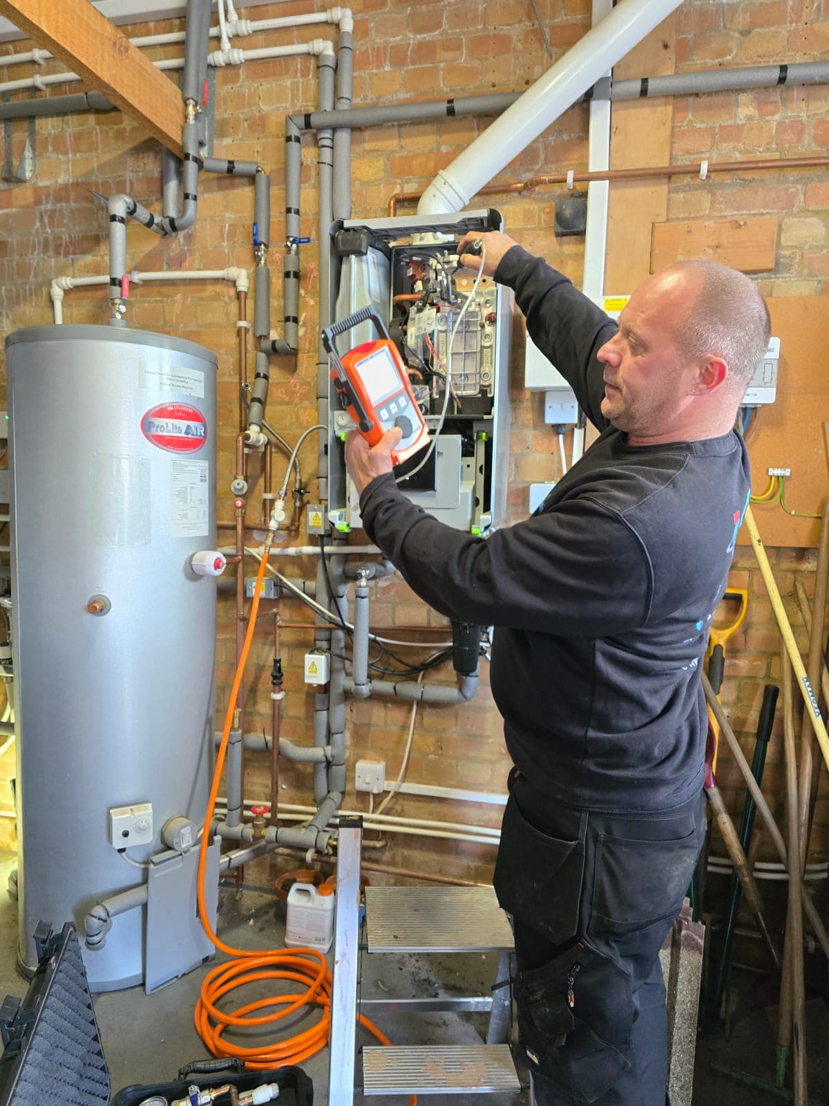 IGM engineer pressure testing a central heating system and hot water cylinder